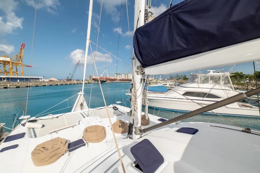 The view forward from the yacht deck moored in a calm marina